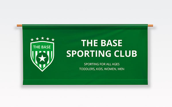 Base sporting club banner displayed prominently on a wall, showcasing team colors and logo for community pride.