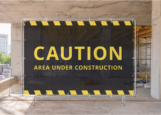 Caution sign indicating an area under construction, featuring a mockup design for safety awareness.