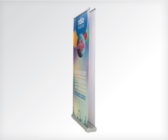 A large roll-up banner stand featuring a vibrant and colorful design, ideal for promotional displays and events.