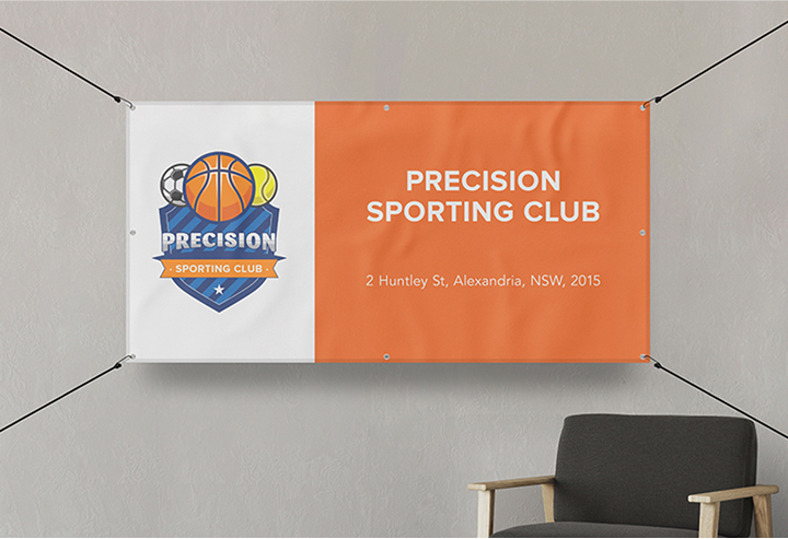 A banner displayed on a wall with a chair positioned in front of it, creating a visually appealing setup.