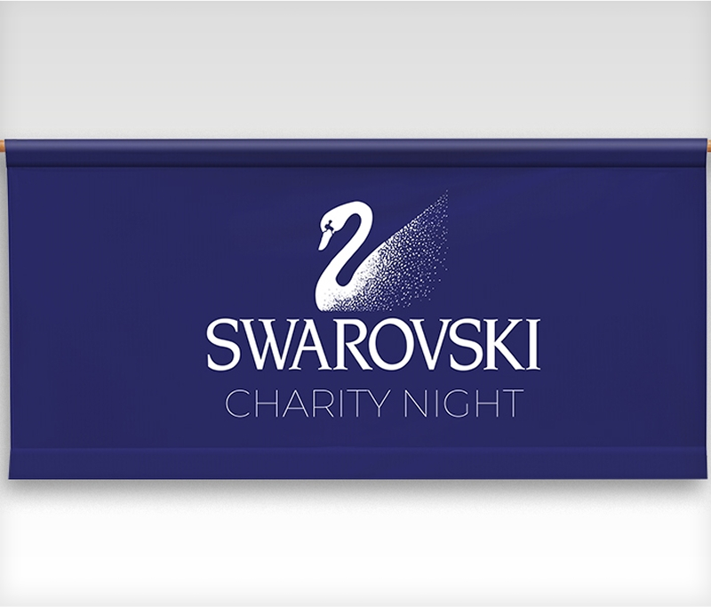 Swarovski charity night banner featuring elegant design and logo, promoting a philanthropic event for a noble cause.