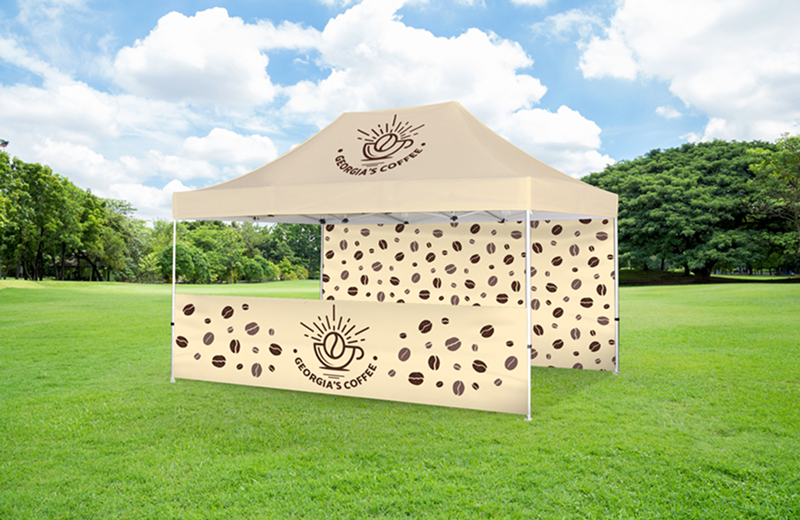 A red canopy tent featuring a wine tasting logo, set up for an outdoor event or festival.