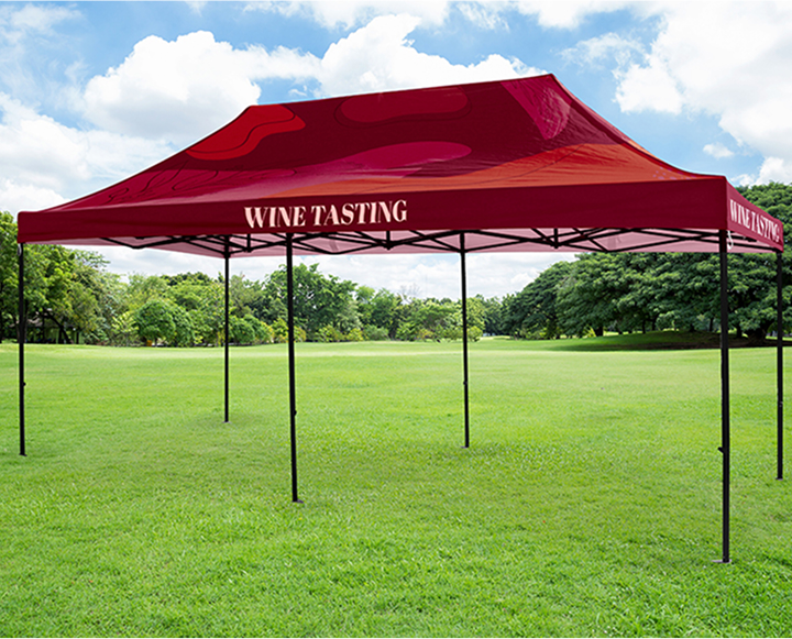 A cozy wine tasting tent with tables set for guests, surrounded by greenery and soft lighting for an inviting atmosphere.