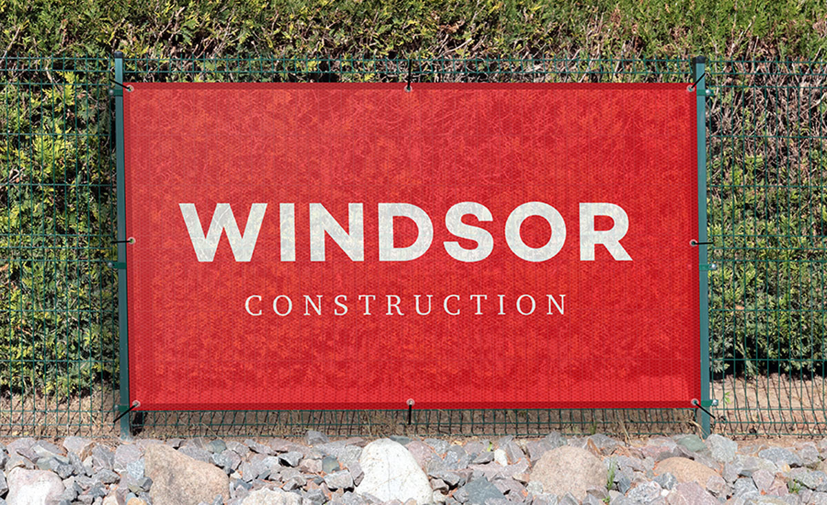 A sign displaying the words Windsor Construction prominently, indicating a construction site or business.