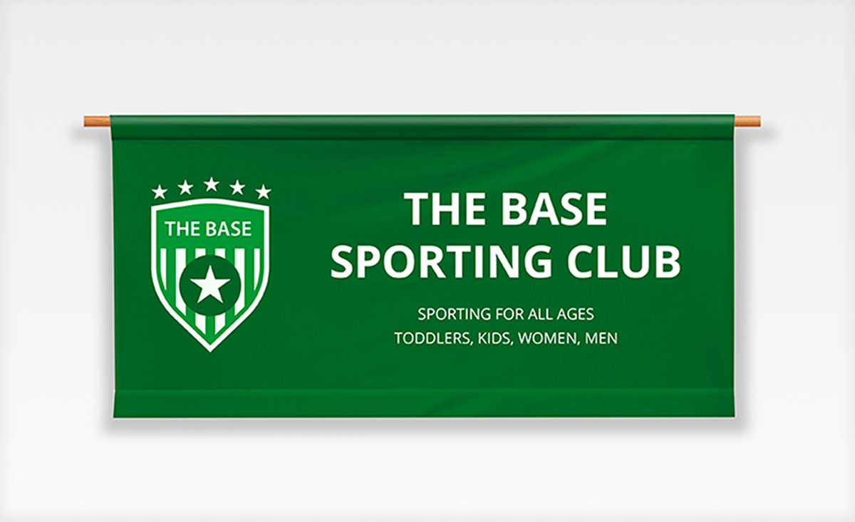 Base sporting club banner displayed prominently on a white wall, showcasing the club's identity and spirit.